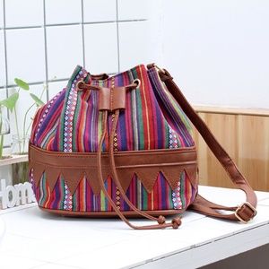 Gorgeous multi color canvas cross body satchel.